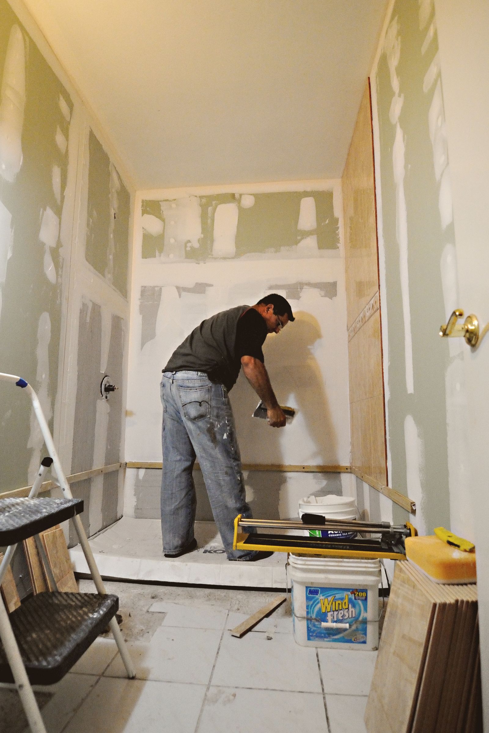 Gutted bathroom being renovated with new plumbing rough-in